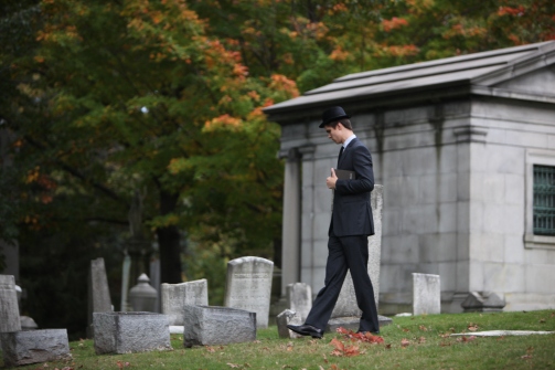 Man walks through cemetery in Rochester, NY